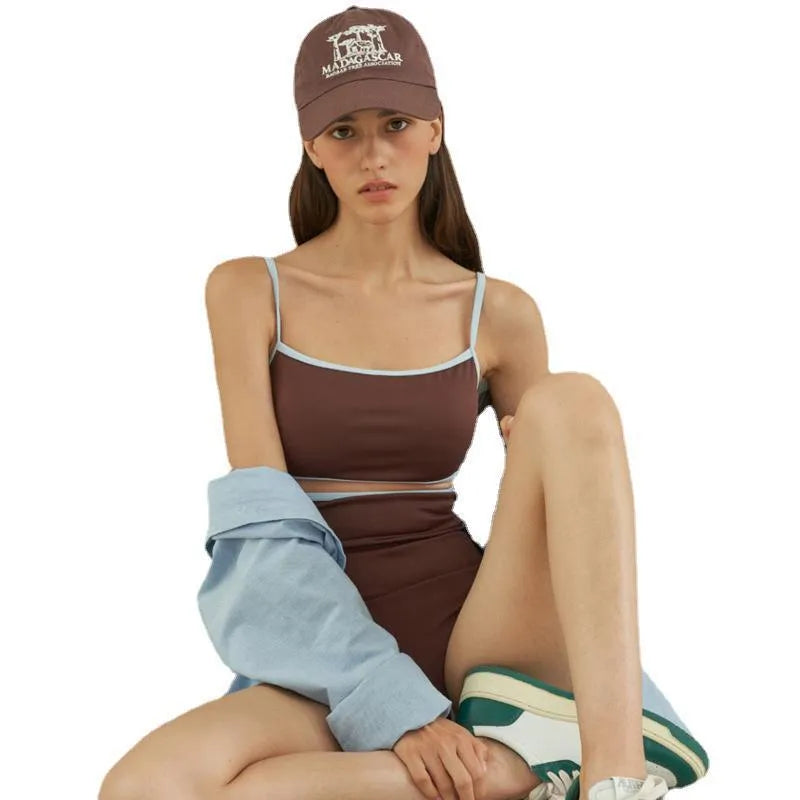 Brown women's one-piece swimsuit with triangle neckline on mannequin