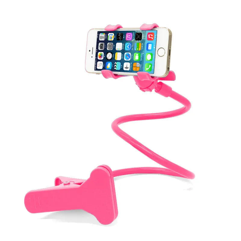 Black flexible arm phone holder with V-clip mounted on bed headboard holding smartphone