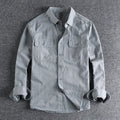 Men's loose long sleeve polyester shirt in cardigan style on a hanger, shown in light grey colour