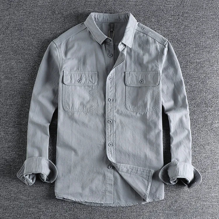 Men's loose long sleeve polyester shirt in cardigan style on a hanger, shown in light grey colour