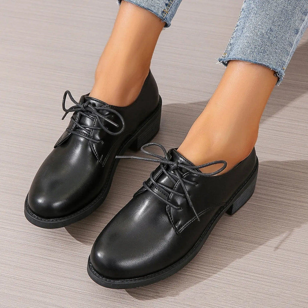 Black women's work shoes with thick chunky heel, PU leather upper, and rubber sole