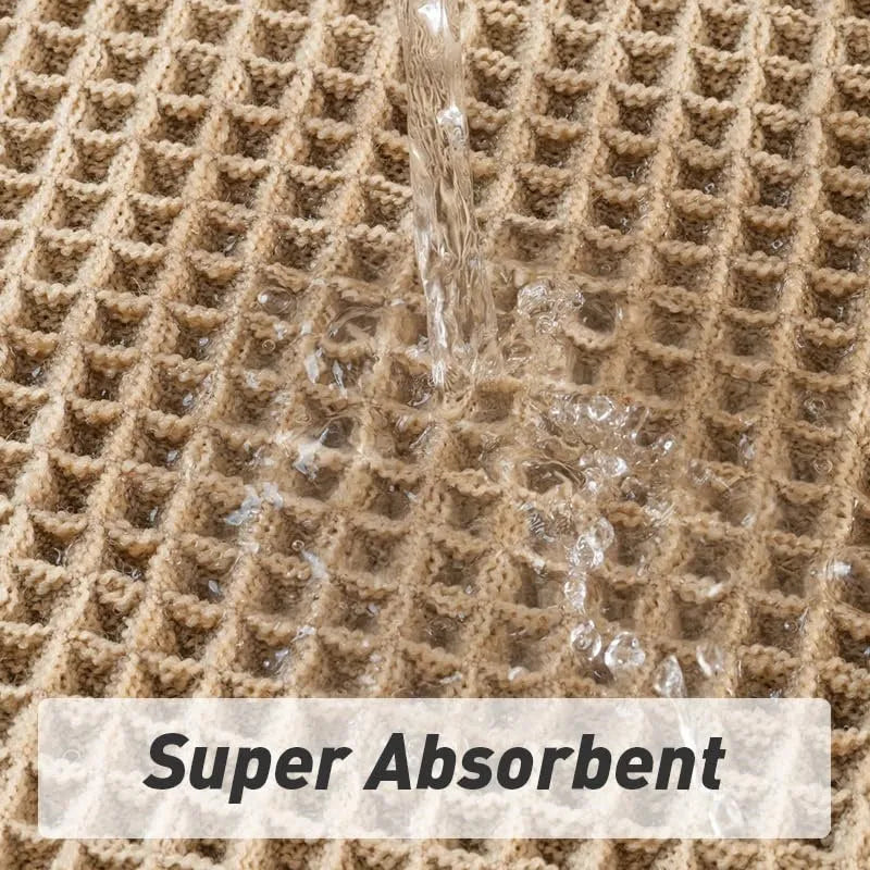 Modern checkered pattern absorbent non-slip bathroom floor mat in a neutral colour on tiled floor.