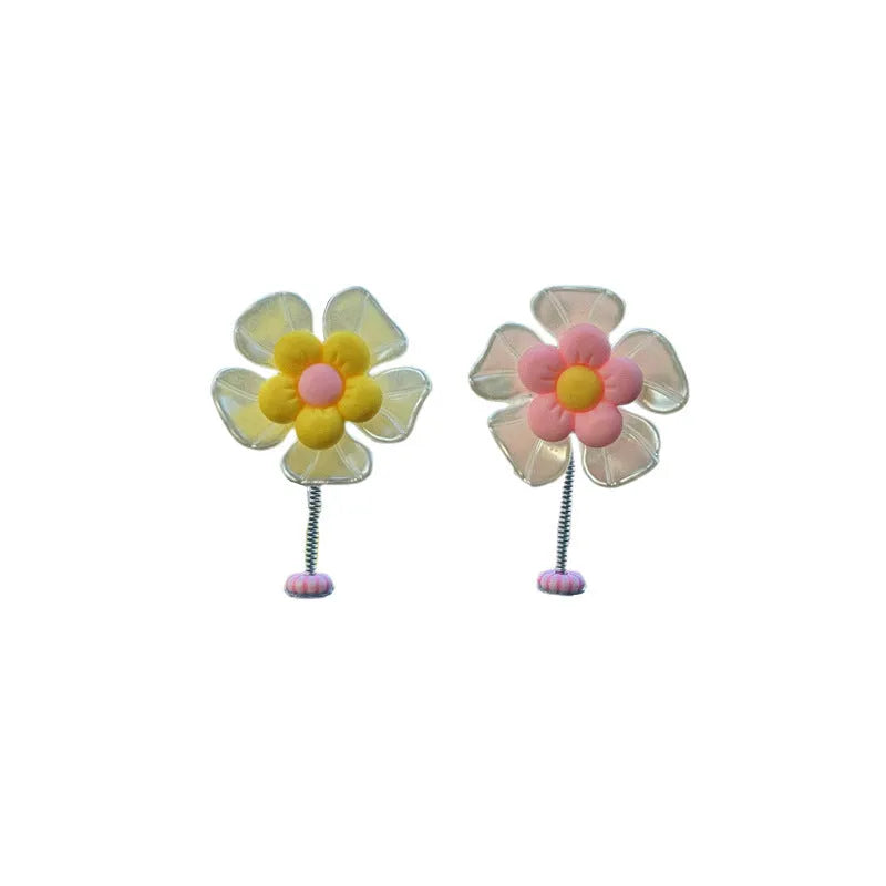 Small plastic swing decoration for car dashboard measuring 50mm by 35mm in multiple colours