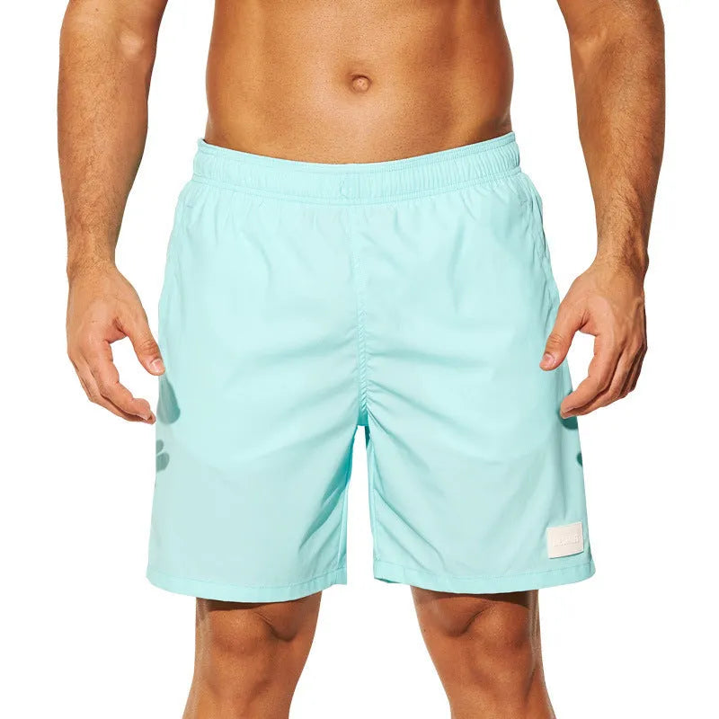 Men's quick-drying nylon beach shorts in solid colours with straight leg opening