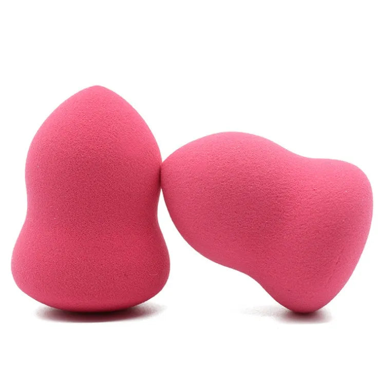 Pink hydrophilic non-latex makeup sponge measuring 4 by 4 by 5.6 centimetres.
