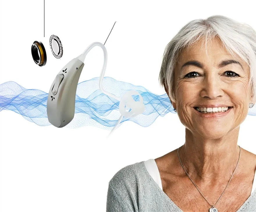 Rechargeable invisible hearing aid and USB charging case on a table.