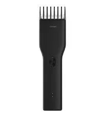 Black and white cordless hair clippers with ceramic blade and adjustable slider comb