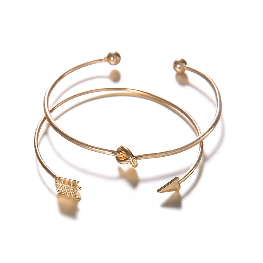 Women's vintage cuff arrow knotted bracelet in gold electroplated alloy