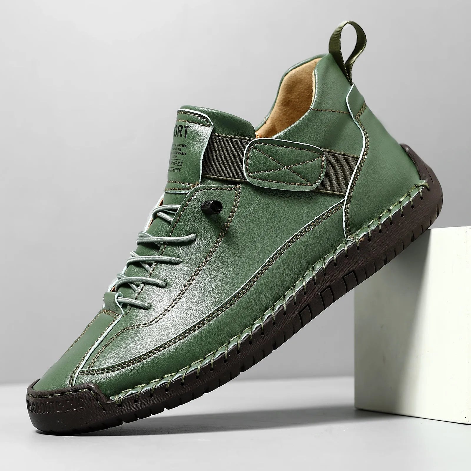 Men's mid-top Martin boot in a solid colour with elastic band and round toe.