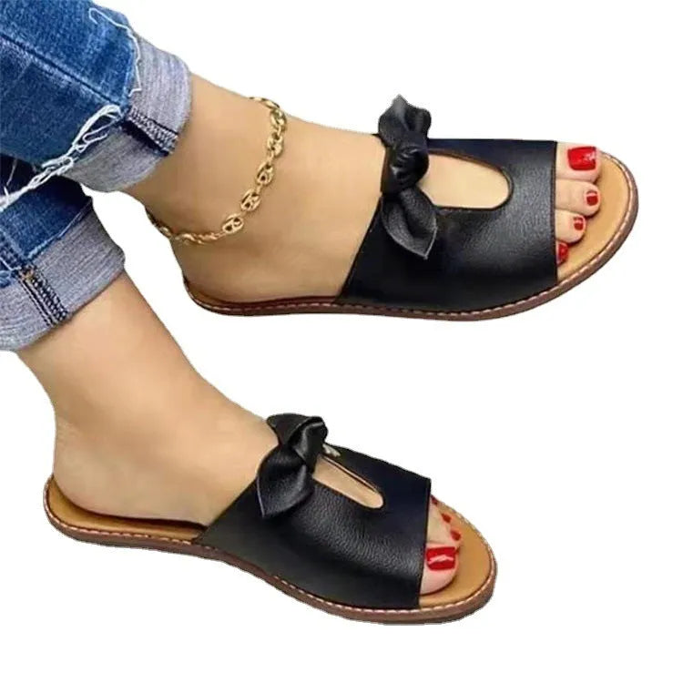Ladies sandals with fish mouth style and bow detail in black, pink, or gold colours