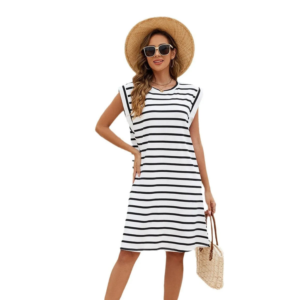 Women's black and white striped polyester beach cover-up blouse on a hanger.