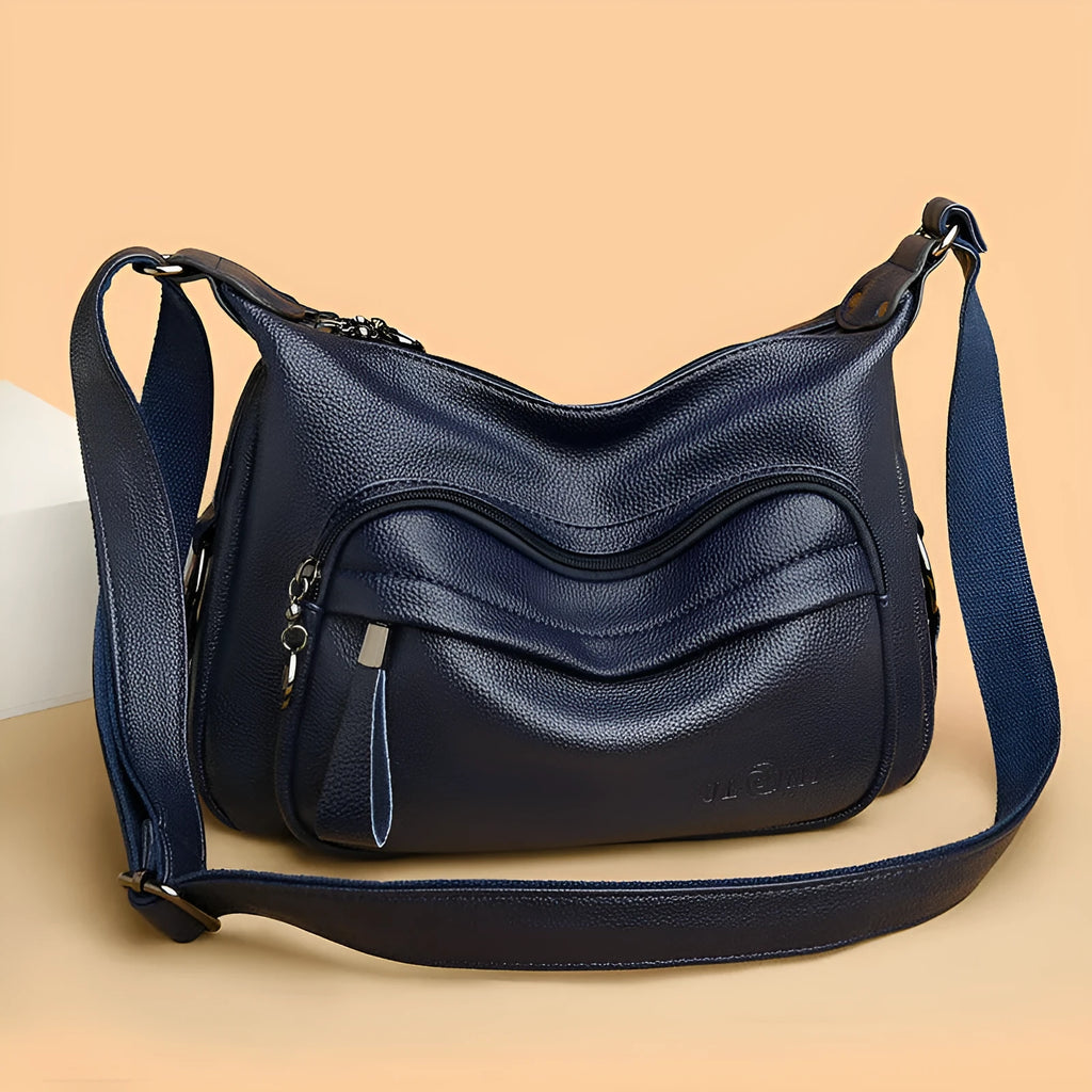 Large black PU shoulder bag with multiple internal compartments showing phone and document sections