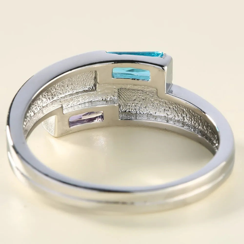 Copper ring with zircon stone inlay in electroplated silver finish showing European styling