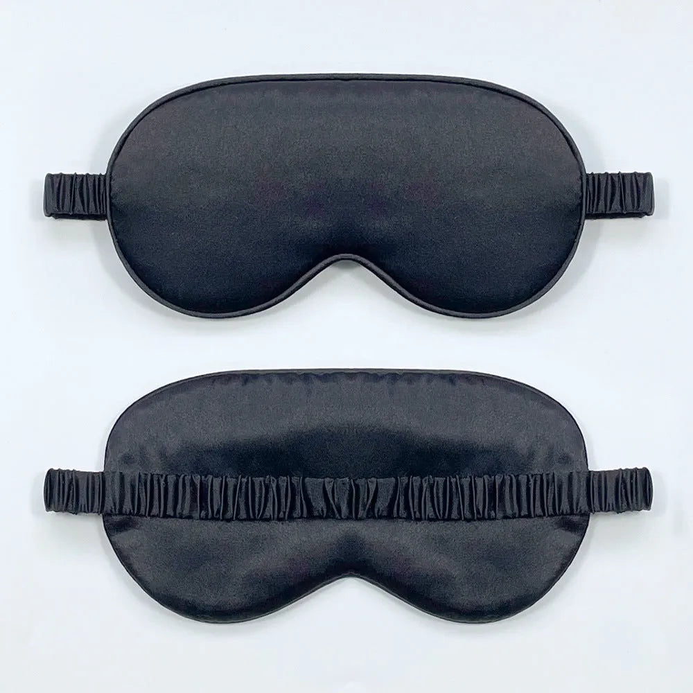 Double-sided Rayon elastic satin sleep mask shown in multiple colour options including sky blue, black, wine red, and light pink.