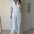 Loose-fit polyester casual top in black, white or yellow with short sleeves