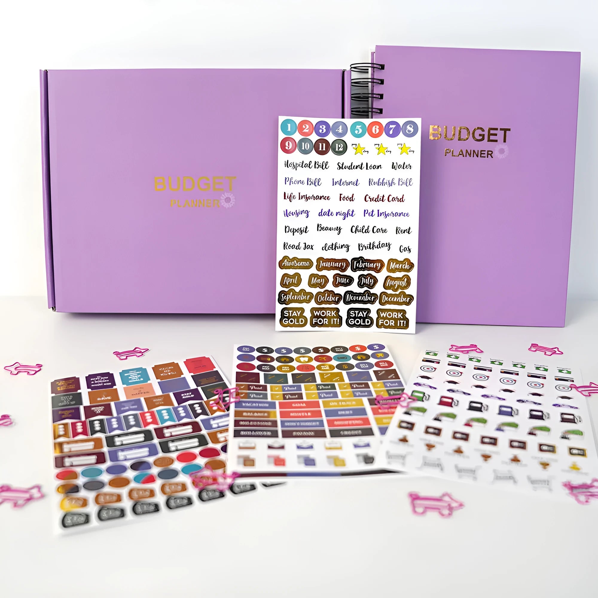 J12 purple coil-bound financial planning notebook with pen and sticker accessories for monthly budgeting