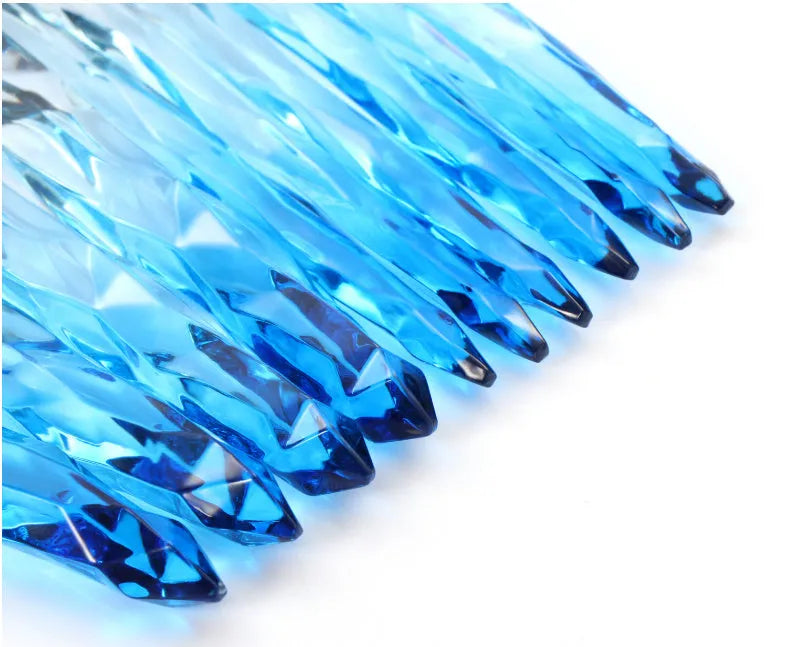 Ten clear crystal diamond shank foundation brushes with artificial fibre heads, shown in a set.