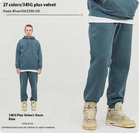 Men's solid colour cotton velvet casual sweatpants with elasticated waist and ankle cuffs.