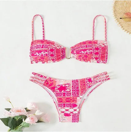 Women's high-waist floral bikini swimsuit on a hanger in blue, orange, pink, and rose red colours.
