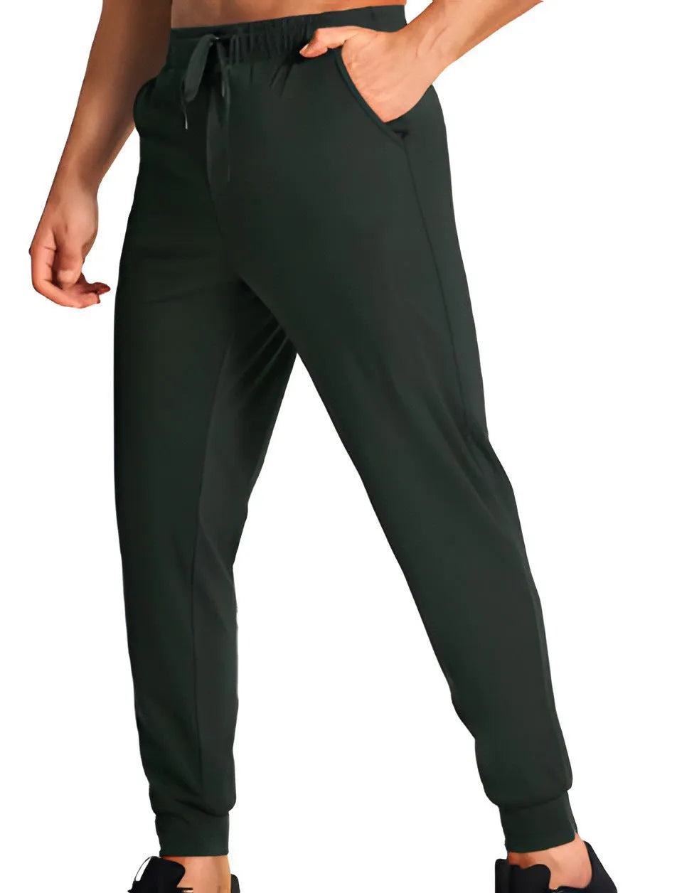 Men's loose-fit solid colour casual trousers on a hanger, showing the relaxed leg cut.