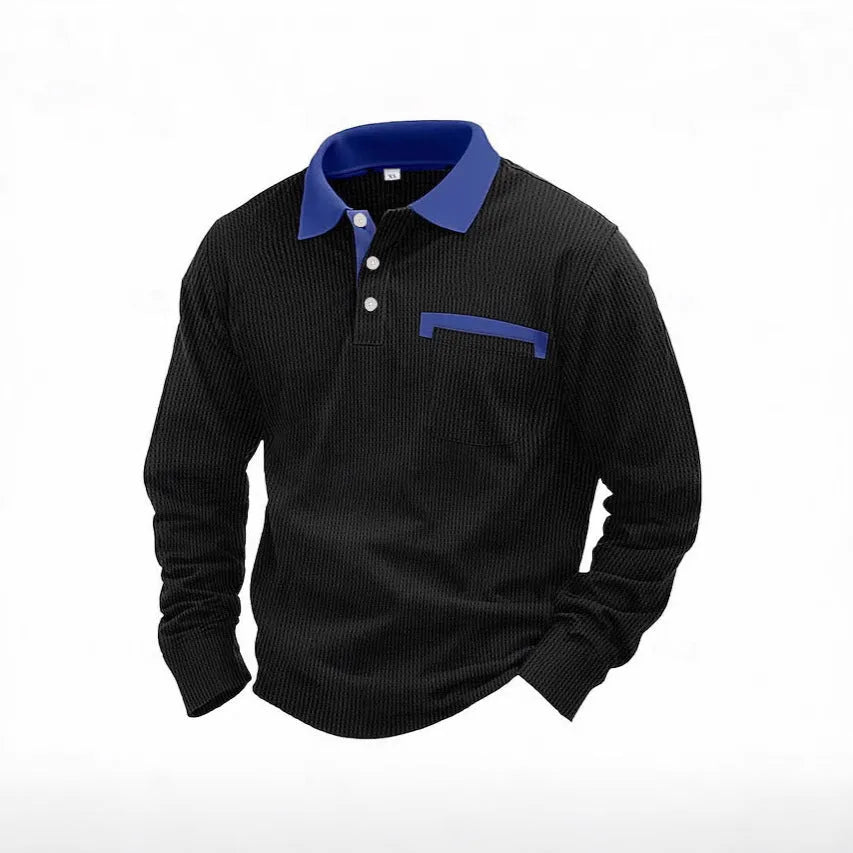 Man modelling a loose-fit long sleeve polo shirt with a waffle-texture fabric in a solid colour.