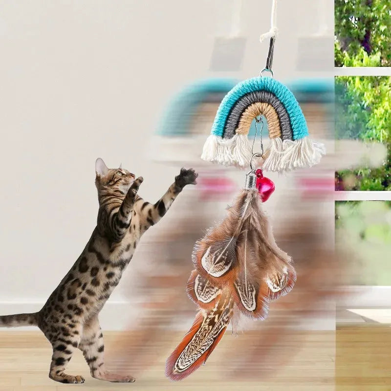 Blue feather cat rope toy hanging from a door with elastic swing and sticky buckle clamp