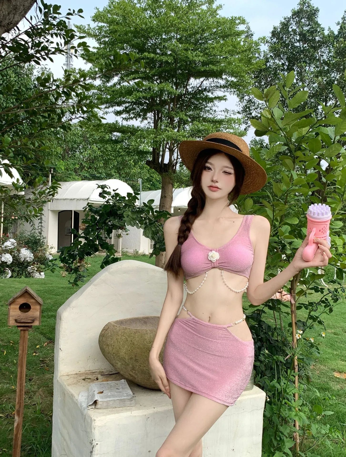 Women's pink and black polyester three-piece bikini swimsuit with high elasticity construction