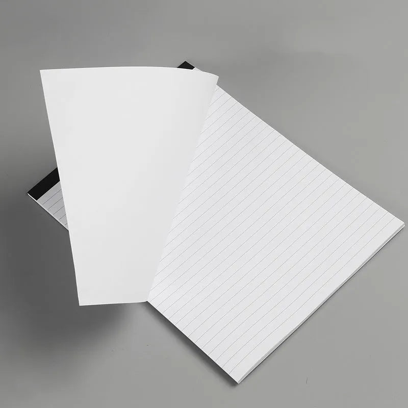 A4 tearable grid notebook with ivory white pages and adhesive binding, shown in open position