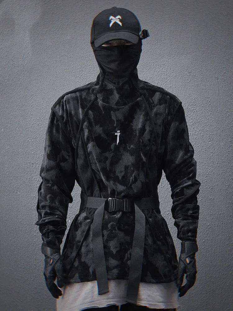 Man modelling a black and grey tie dye finger turtleneck sweater with drop shoulders.