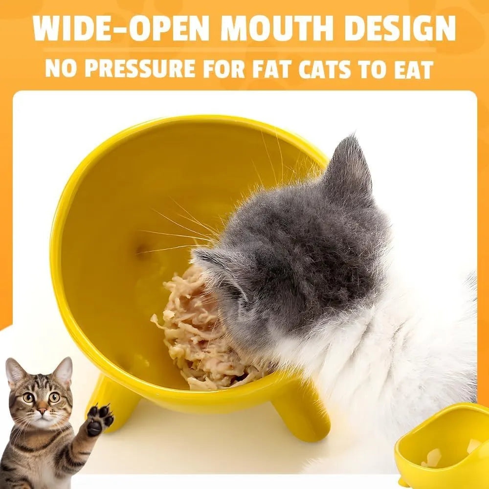 Green ceramic cat food bowl with four legs and rounded arc design on wooden floor