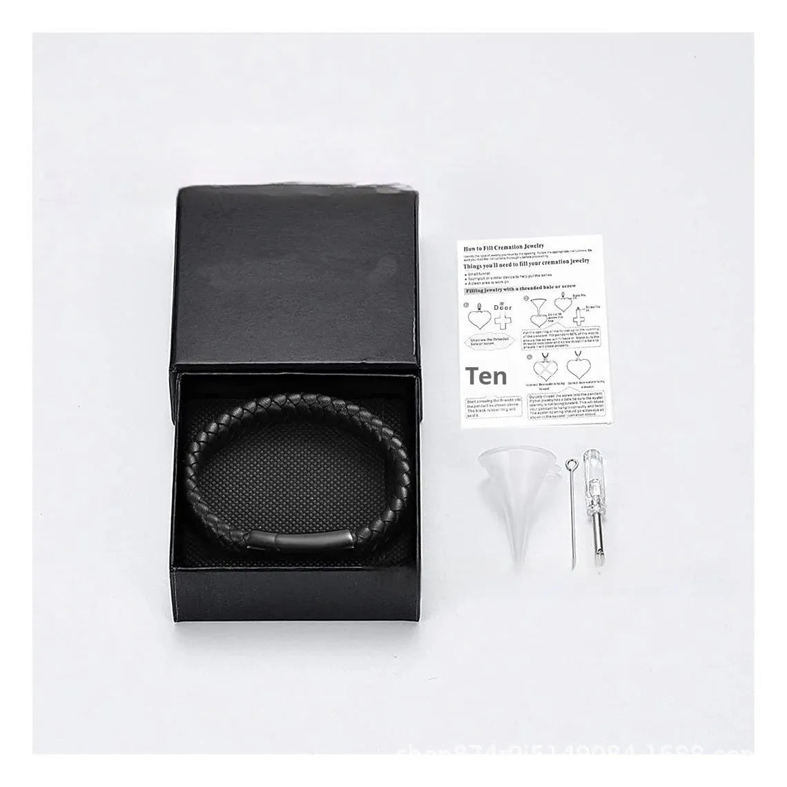 Black stainless steel memorial bracelet with a woven leather compartment for ashes and an engraved plate.