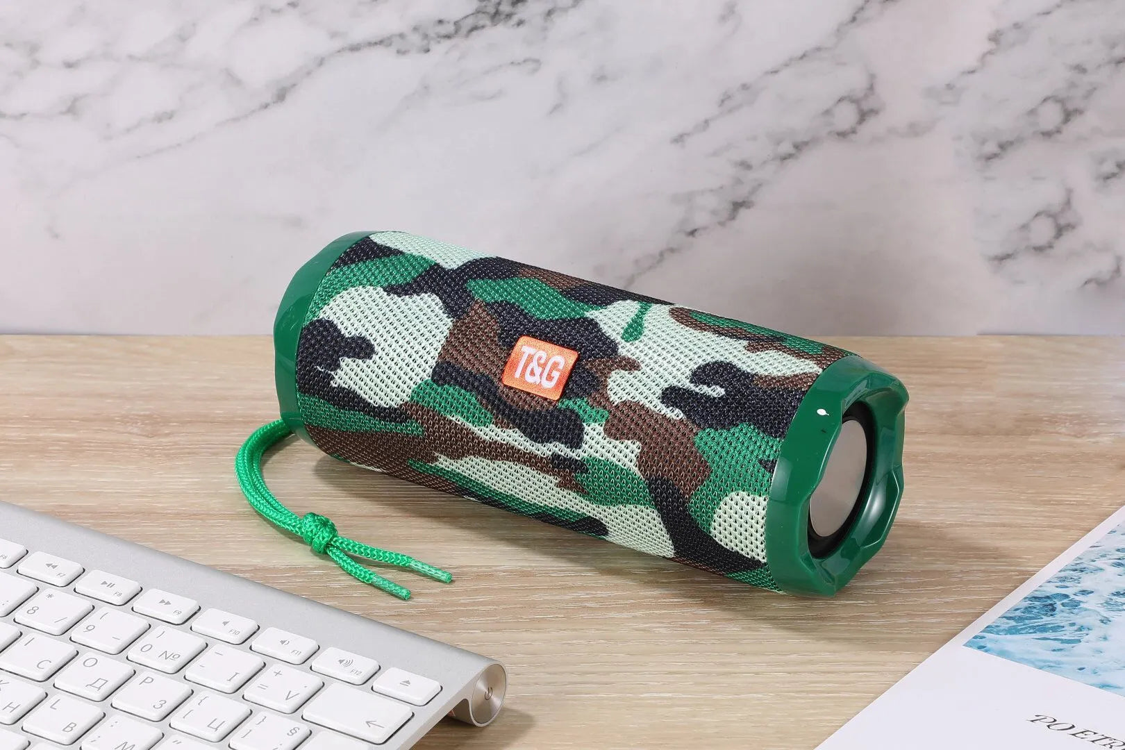 Fabric-covered portable Bluetooth speaker with integrated card holder slot in blue colour