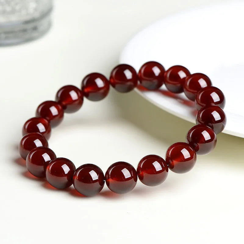 Natural orange red garnet crystal ball bracelet with Ruyi symbols in retro unisex design