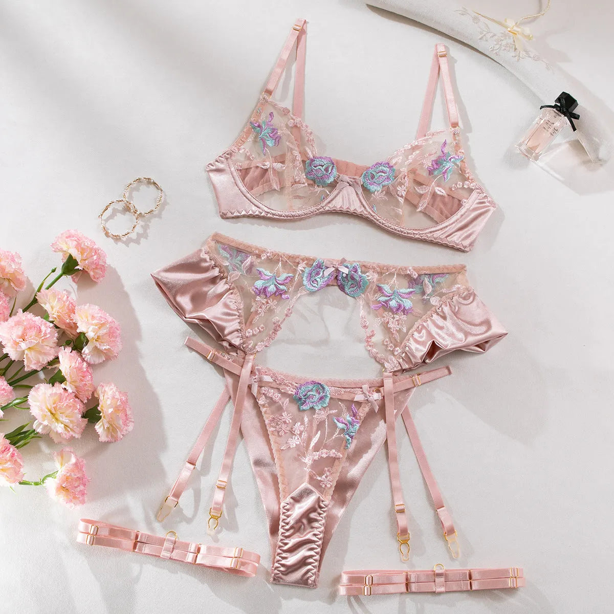 Light purple satin lingerie four-piece set with embroidery details on mercedized fabric