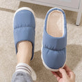 Down cotton indoor slippers with artificial leather upper and rubber sole in various colours