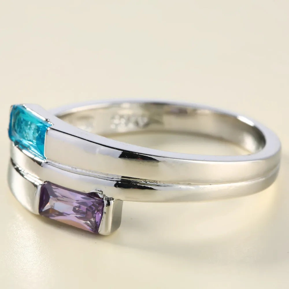Copper ring with zircon stone inlay in electroplated silver finish showing European styling