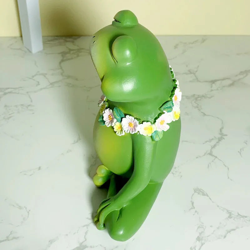 Magic Yoga Frog plastic and resin home ornament in RDW123 colour on a shelf.