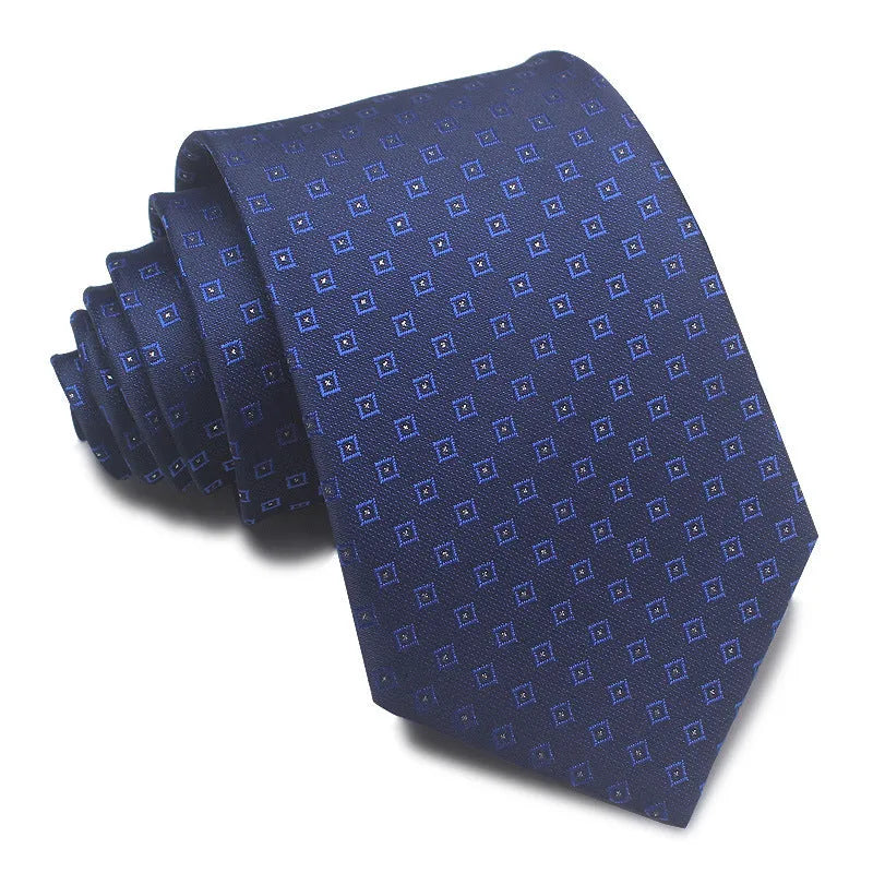 Close-up of a red, black, and blue striped men's formal tie with a textured Jacquard weave.