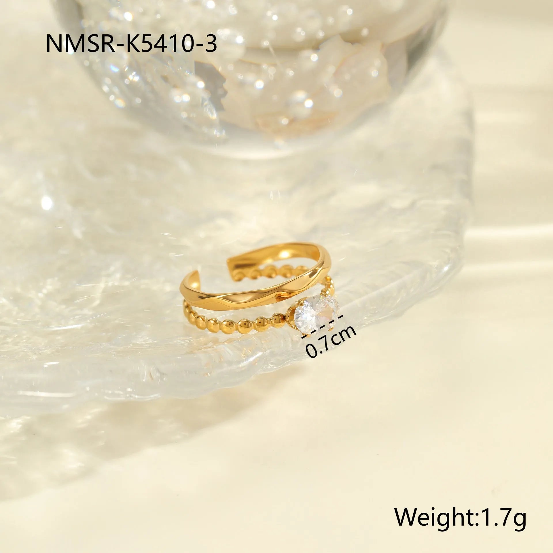 Gold-coloured stainless steel open ring with zircon stones in a geometric heart design.