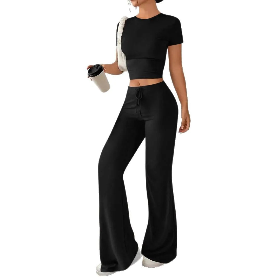 Black high-waist trousers and short sleeve t-shirt co-ord set for women.