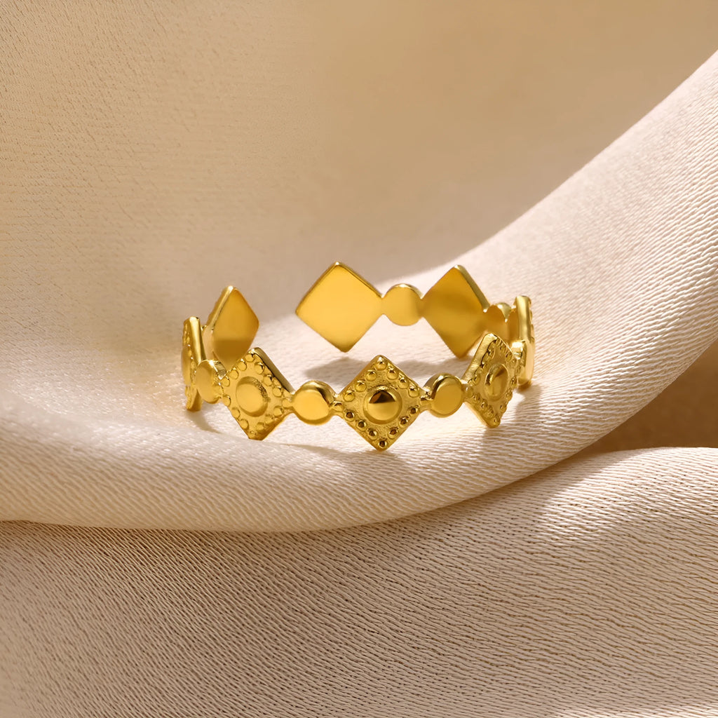 Golden geometric women's ring with diamond pattern on titanium steel band