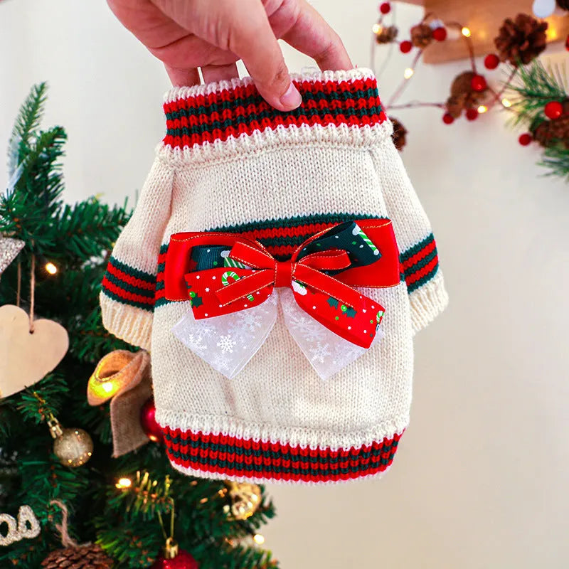 Red and green Merry Christmas dog jumpers for small to large pets on a festive background