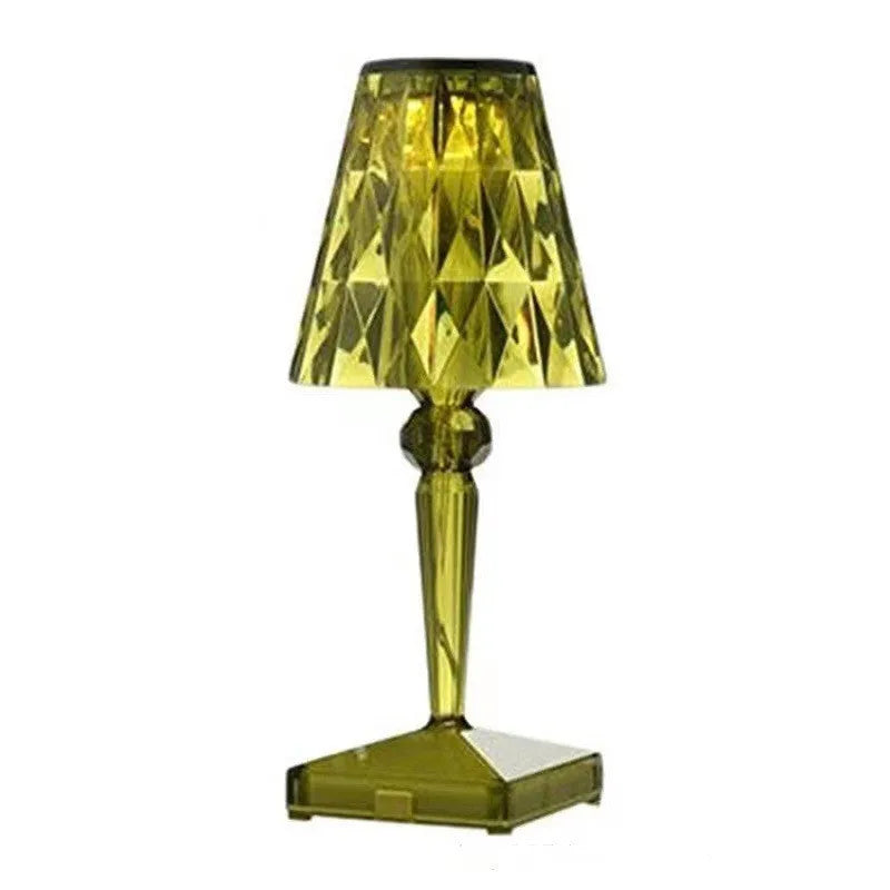 Rose gold plated acrylic portable touch night light with projection feature and rechargeable base on a wooden table