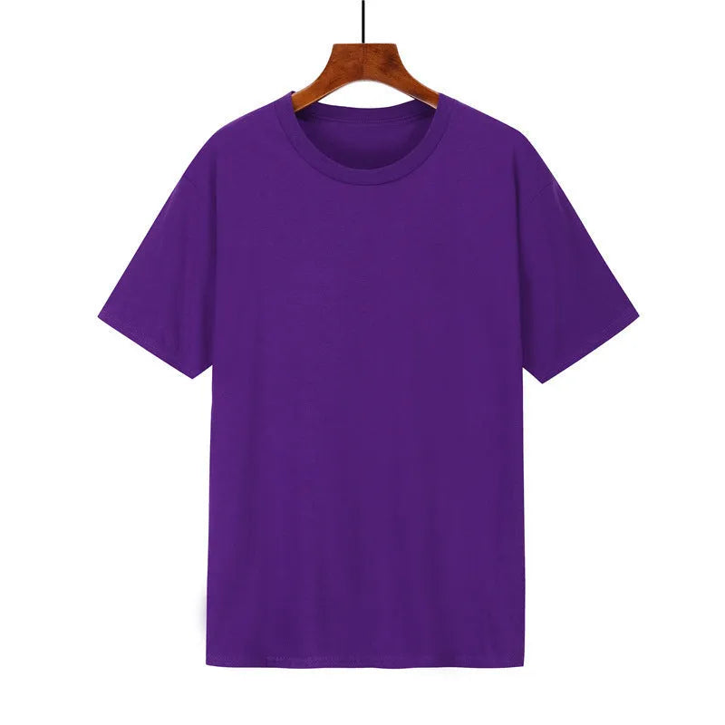 Men's loose-fit cotton t-shirt in black, shown on a model, with short sleeves.