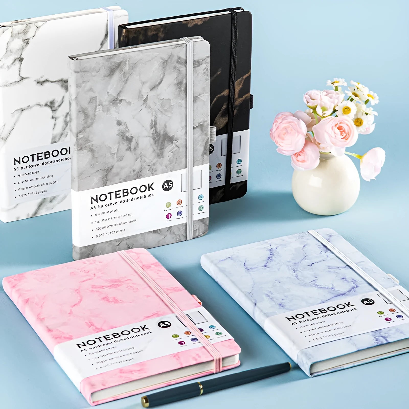 A5 PU leather notebook with strap closure, open to show horizontal line ruled pages.