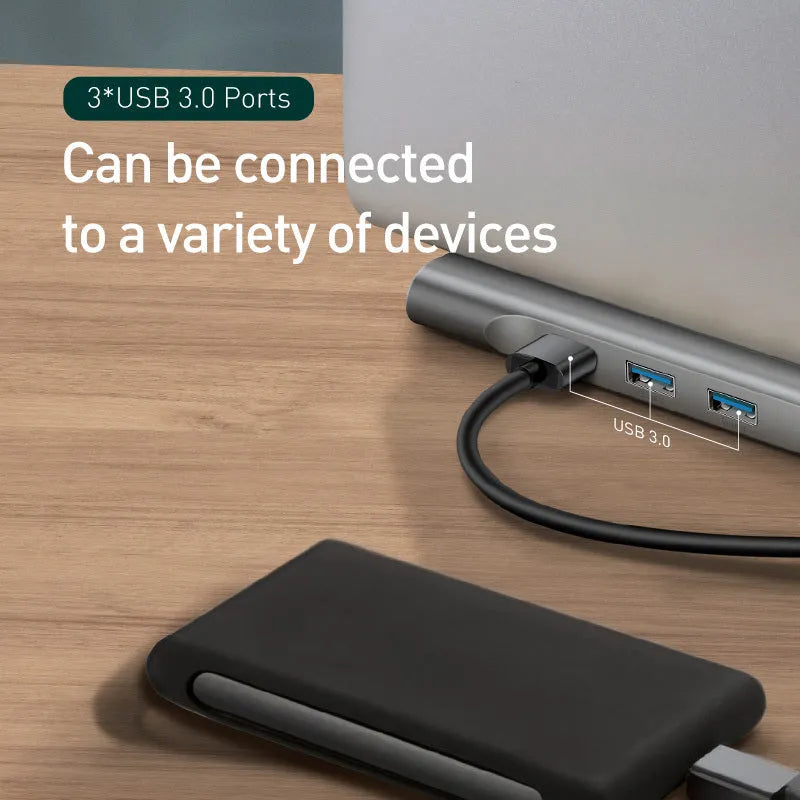 Grey aluminium USB-C docking station with cooling bracket showing ten ports including HDMI and Ethernet