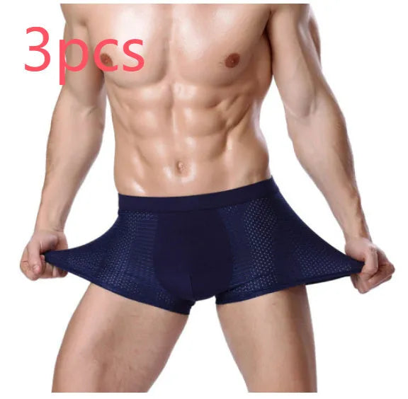 Men's solid colour ice silk modal boxer briefs with U-type convex design and mesh fabric.