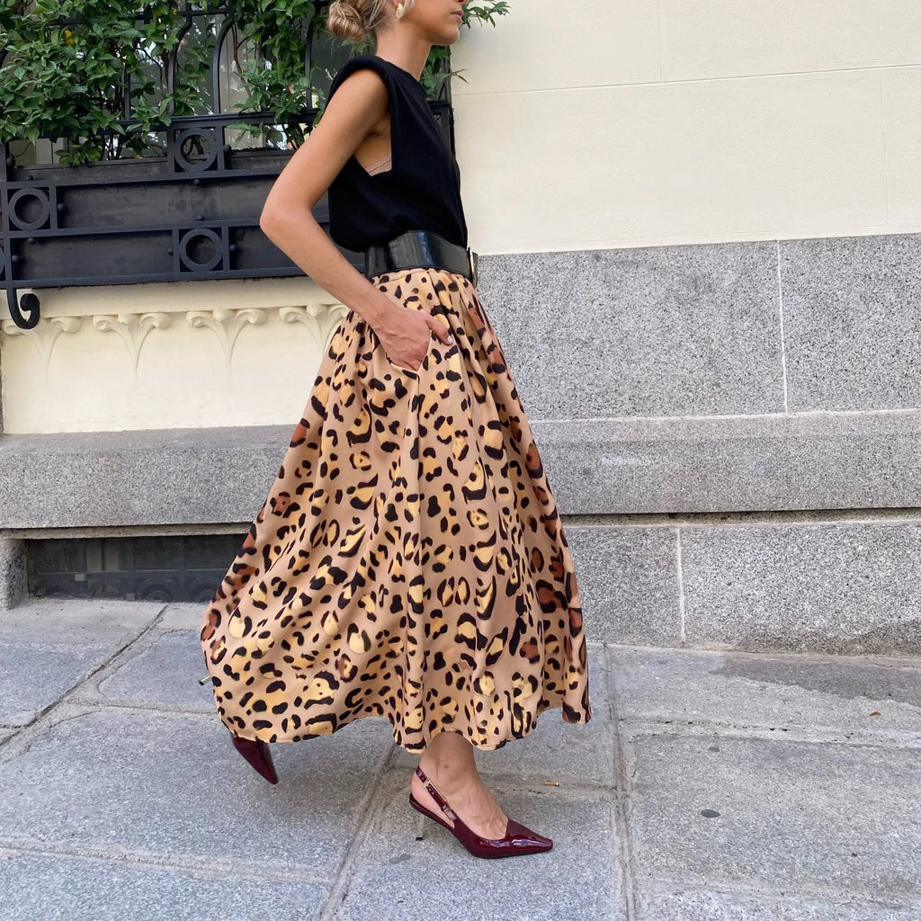 Brown leopard print women's A-line long skirt with big hem design shown in socialite styling