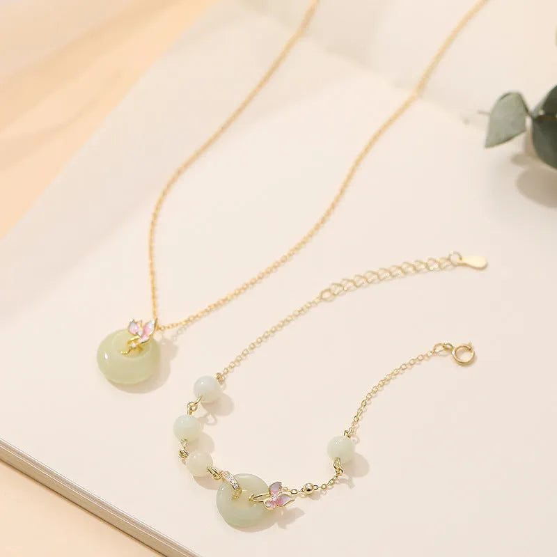 Silver orchid necklace with peace buckle clasp and floral pendant on O-ring chain