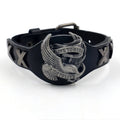 Black geometric leather bracelet with a silver watch-button clasp on a unisex wrist.